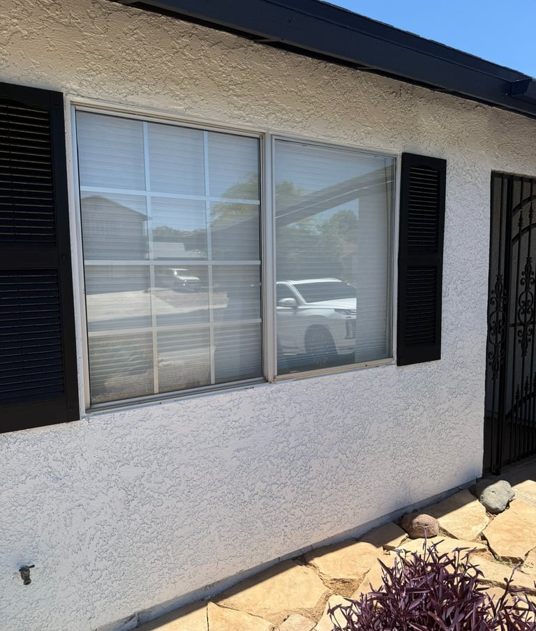 Split window without solar window screens with a colonial window pattern on the left .