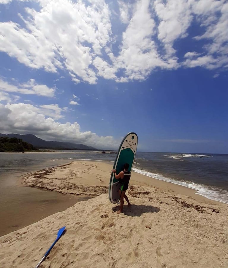 Paddle board at Don Diego River near Tayrona Park in Colombia