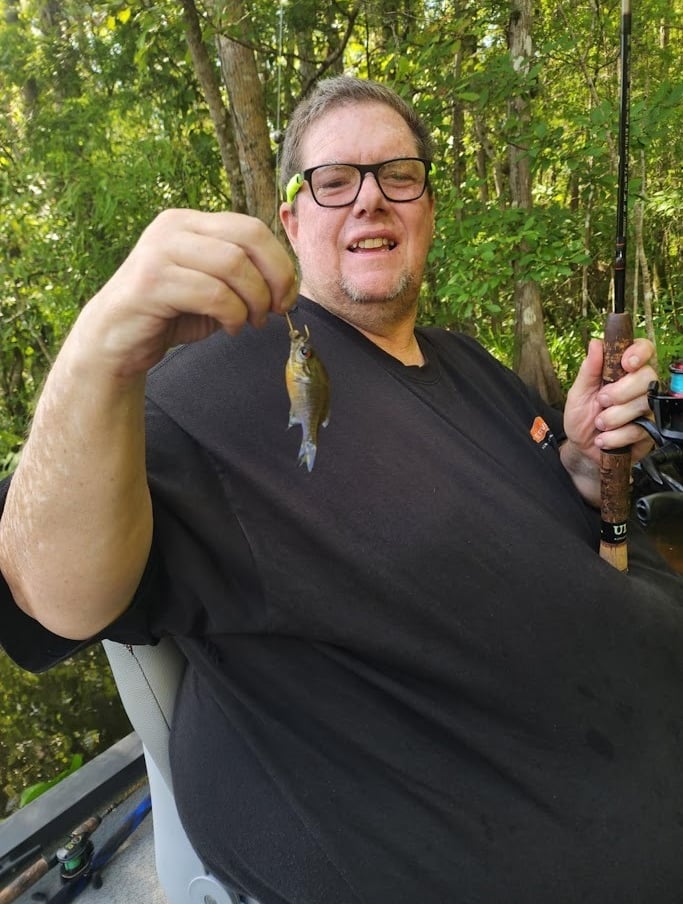 Paul holding a small bream