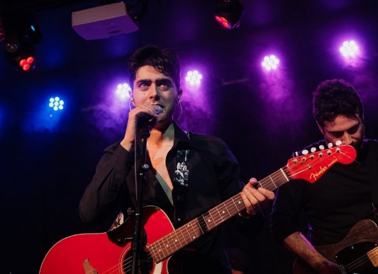 Brighton rock singer Olly Williams performing live with band