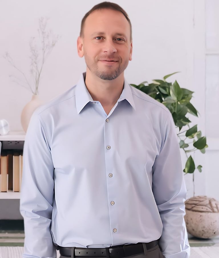 a man in a blue shirt and a laptop