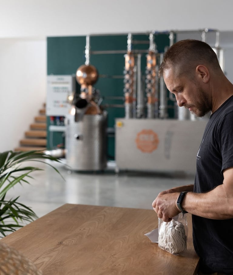 master distiller is sampling botanicals