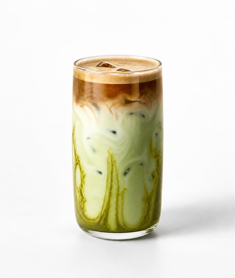 Iced dirty matcha latte with espresso shot and green tea swirls in a tall glass.