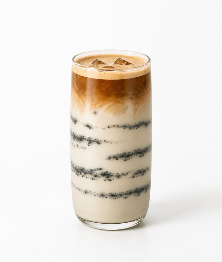 Iced black sesame latte with layered espresso and milk in a tall glass over a white background.