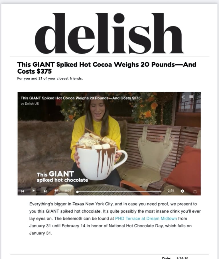 a lady holding a 20 lb boozy hot chocolate