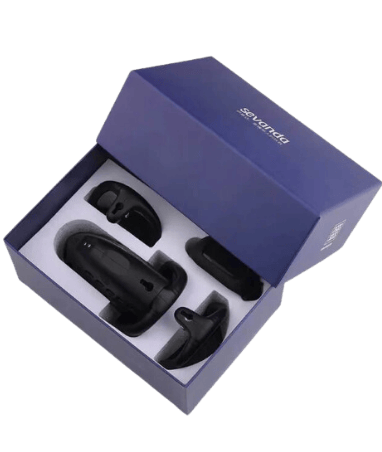 a picture of a black chastity cage with accessories in the box the picture is taken from above