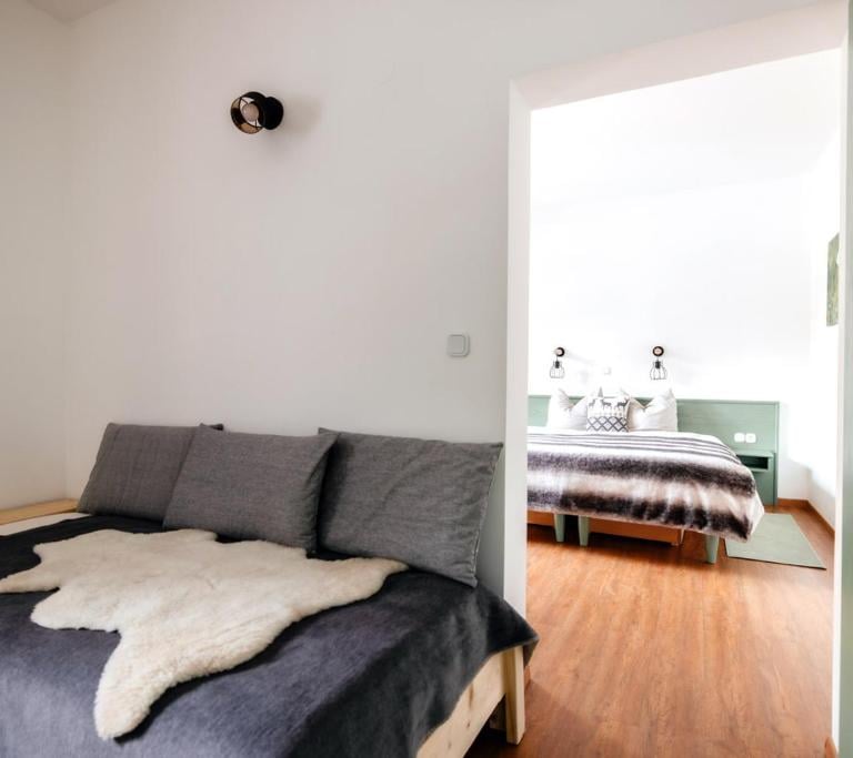 a bedroom with a bed and a bed in the middle of the room