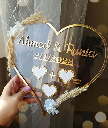 a person holding a heart shaped mirror
