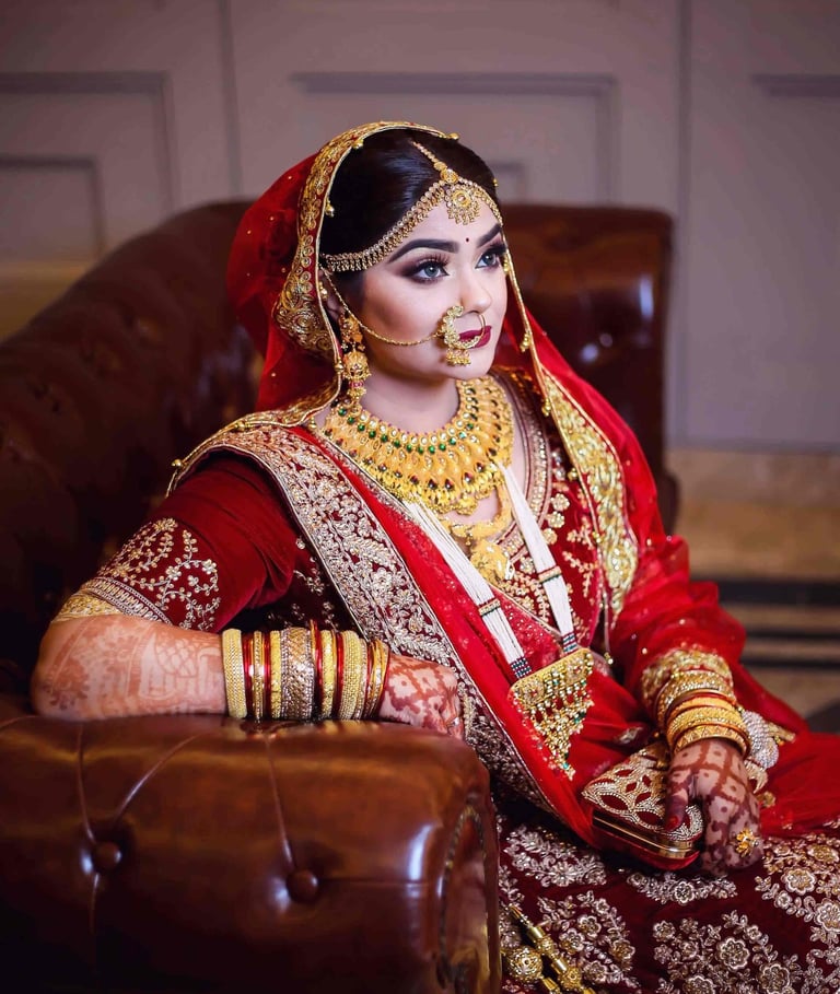 a bride in a red and gold bridalle wedding dress