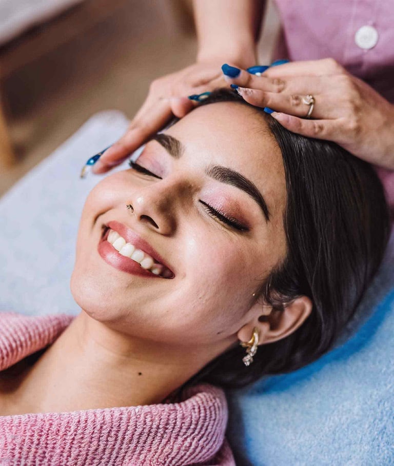 a woman getting her facial massage on the face