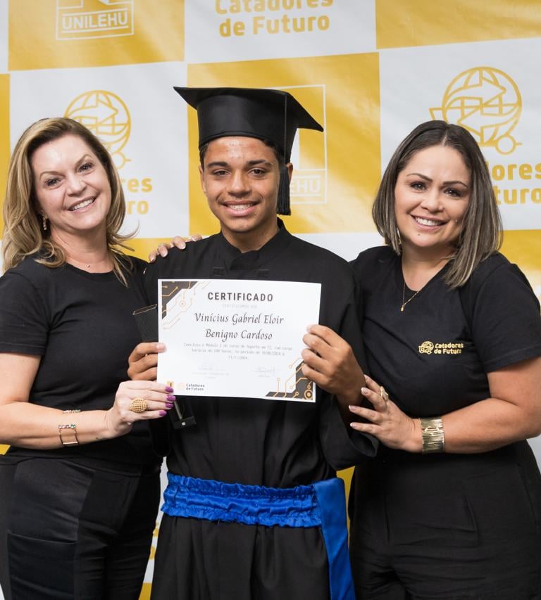 a man and woman in black and white graduation gowns