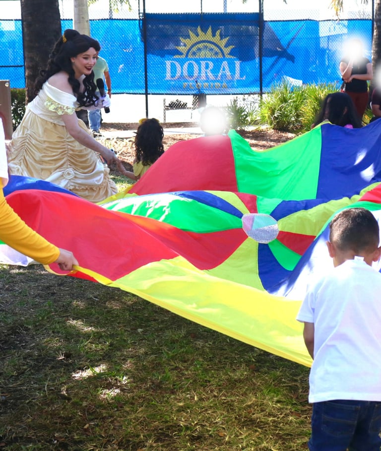 a group of people standing around a colorful parachute