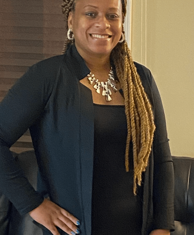 a woman in a black shirt and a black jacket