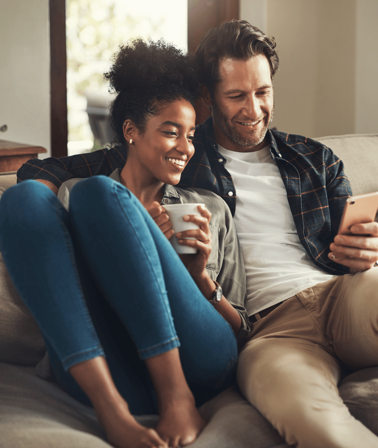 a man and woman sitting on a couch