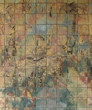 a bathroom with a toilet and a toilet paper towel