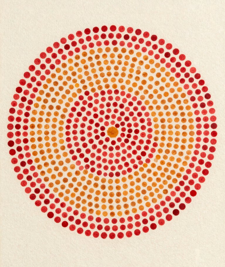 Close flatlay of a small pointillist panel, tightly packed crimson and ochre dots forming a dense circular cluster on ivory ground, diffuse north-facing studio light, edges of canvas visible