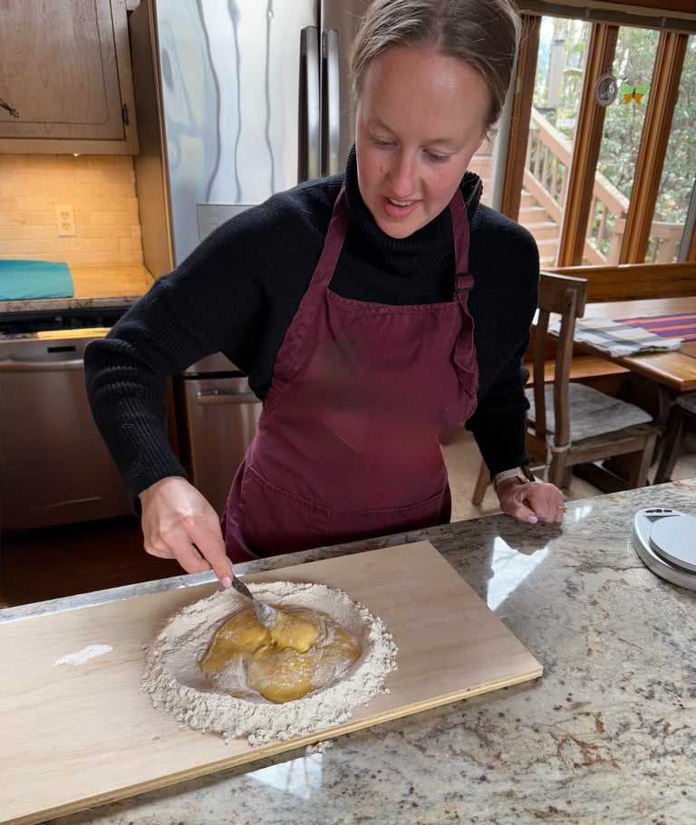 Class participant making pasta dough