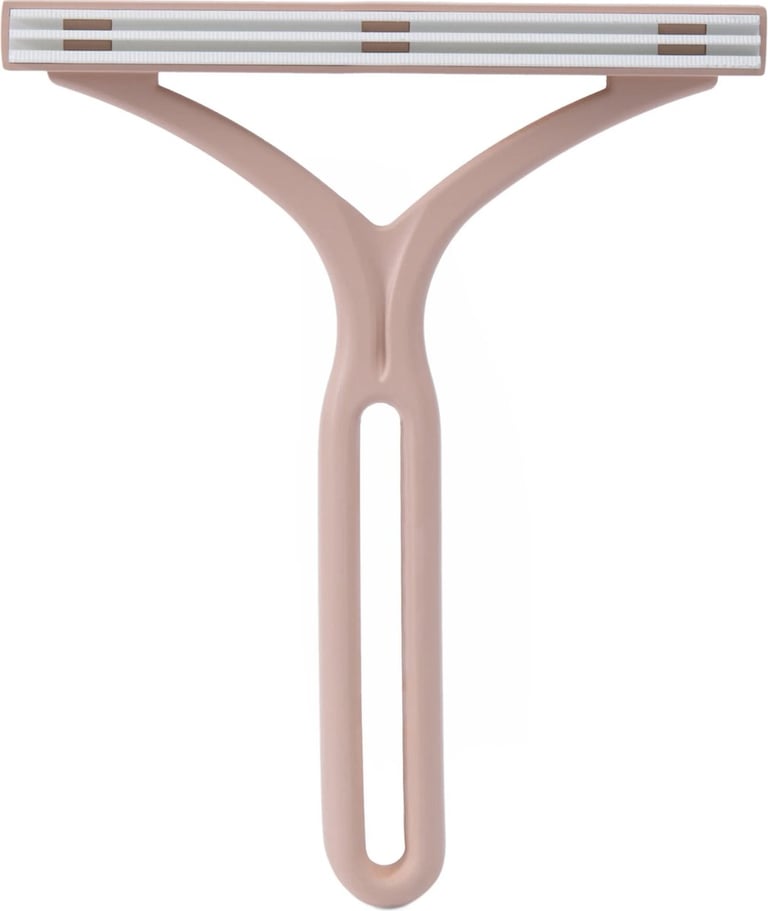 Roze handmatige harenverwijderaar borstel voor het reinigen van textiel en het verwijderen van diere