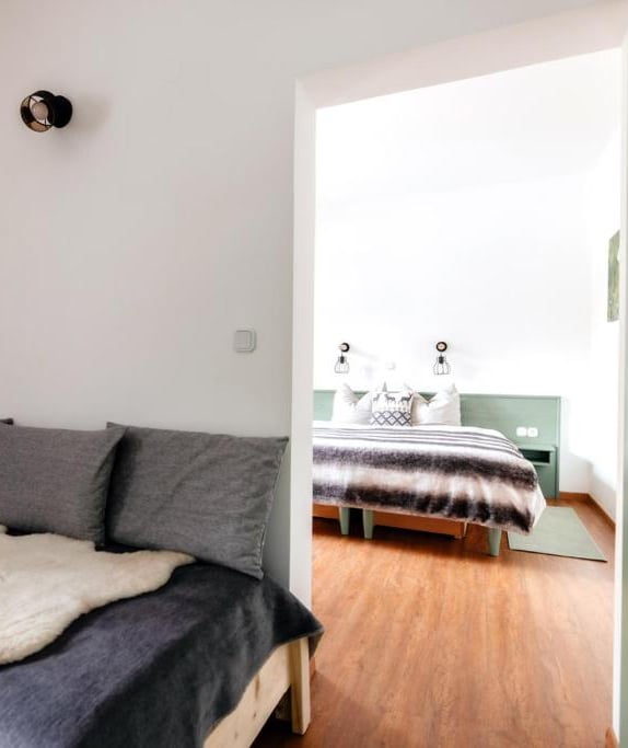 a bedroom with a bed and a bed in the middle of the room