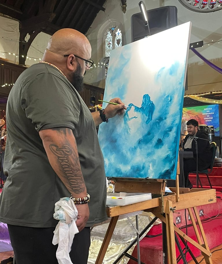 a man is painting a picture of Jesus healing the broken 