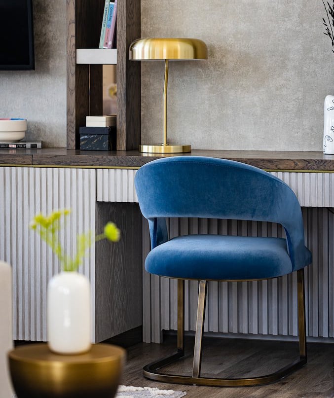a blue chair with a blue chair and a tv