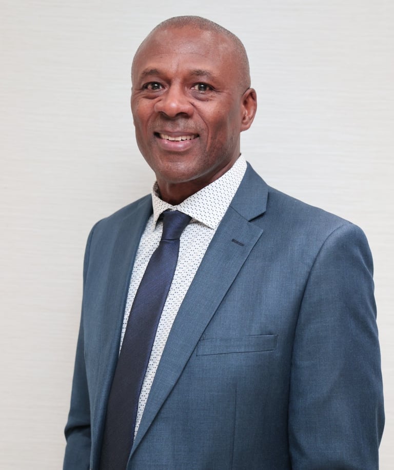 a man in a suit and tie smiling