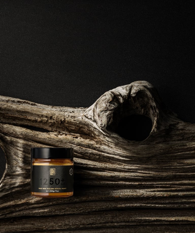 Product photography - a jar of honey on a branch