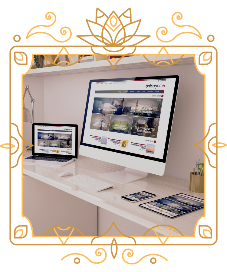 two computers, a phone and an iPad on a desk in a victorian frame
