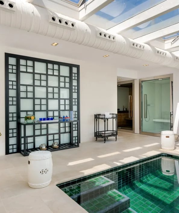 Indoor spa with heated pool, sauna, and relaxation area at Villa El Olivo, Marbella