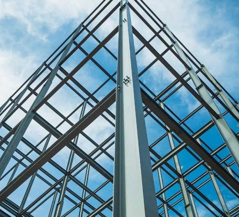 a tall metal structure with a sky background