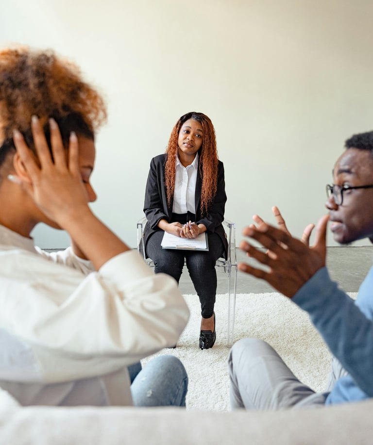 Therapist helping a couple communicate during an emotionally charged therapy session Couples therapy