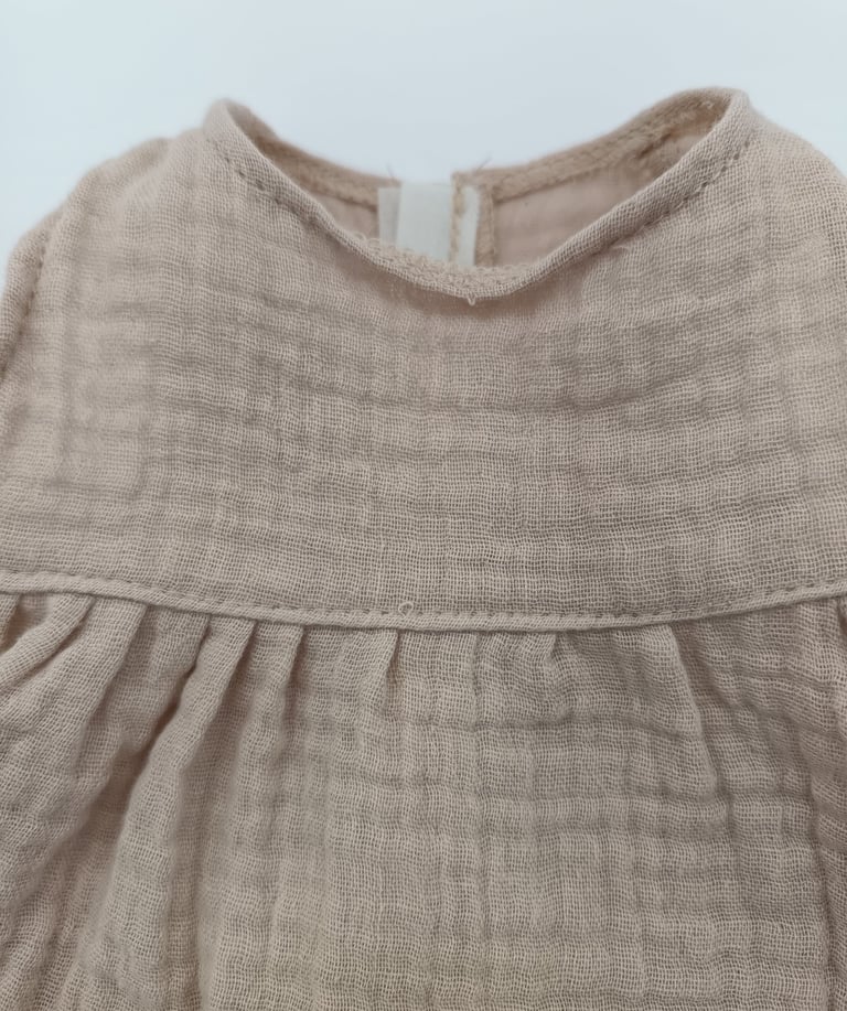 Uneven gathering and loose stitches on Minikane doll outfit