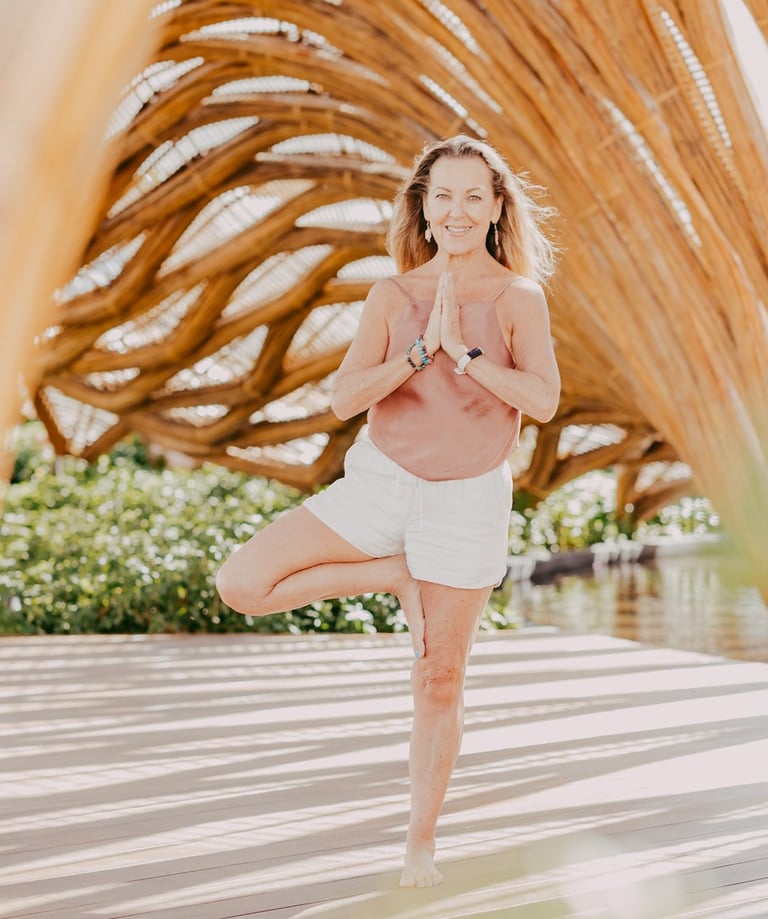 Erin B in a yoga pose at a retreat in Mexico