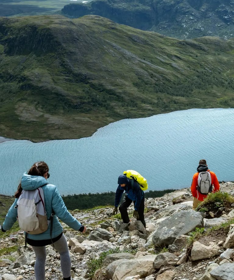 a group of people hiking up a mountain