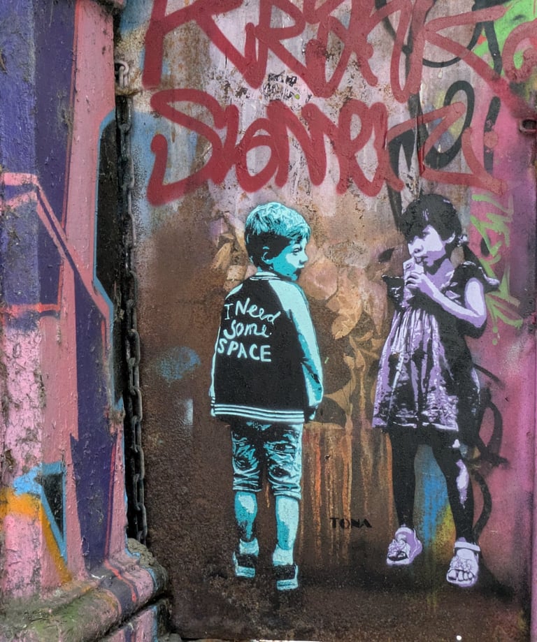 Street art at Rote Flora Hamburg with children stencil graffiti, urbane Kunst und Graffiti Szene in St. Pauli