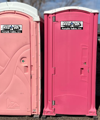 Two pink portable toilets from David & Son's Portable Toilets, LLC for event sanitation.