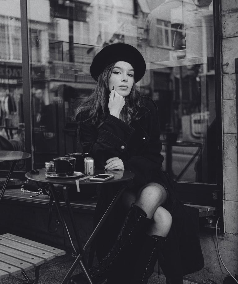 An Introvert sitting alone at a cafe thinking about how to date as an introvert