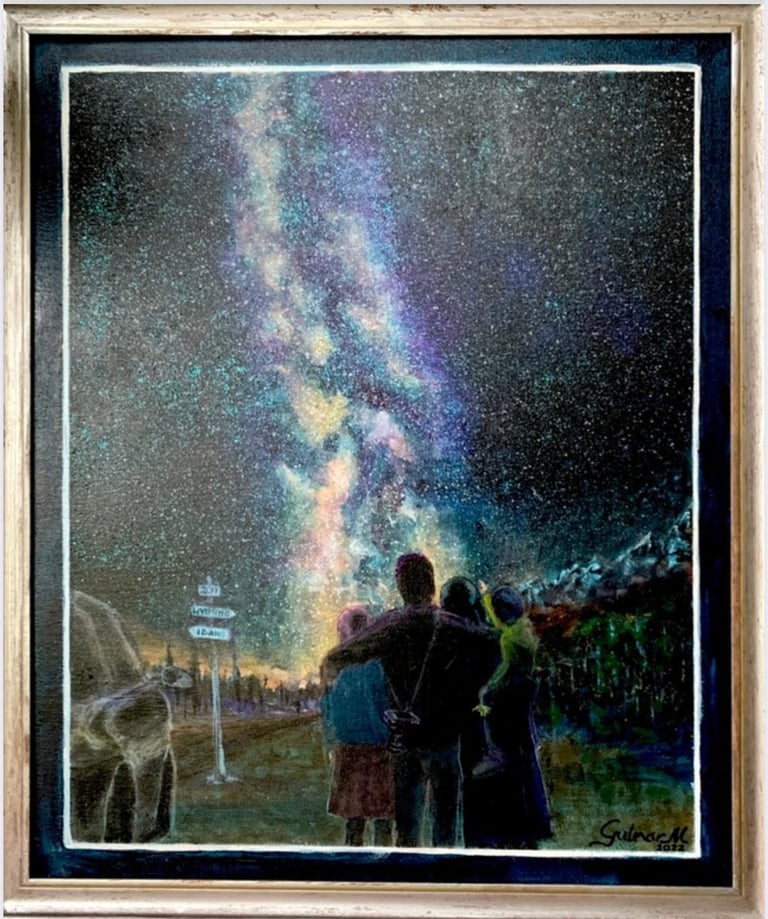 Family of four admiring Milky Way in the mountains