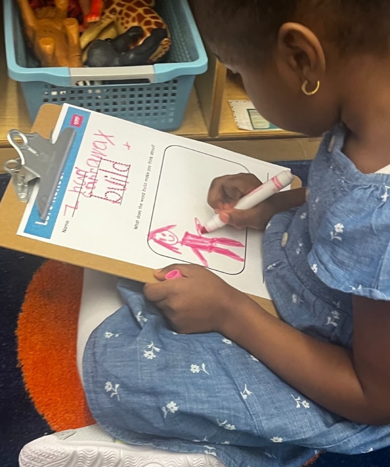 PreK students reflects on an OOPA worksheet.
