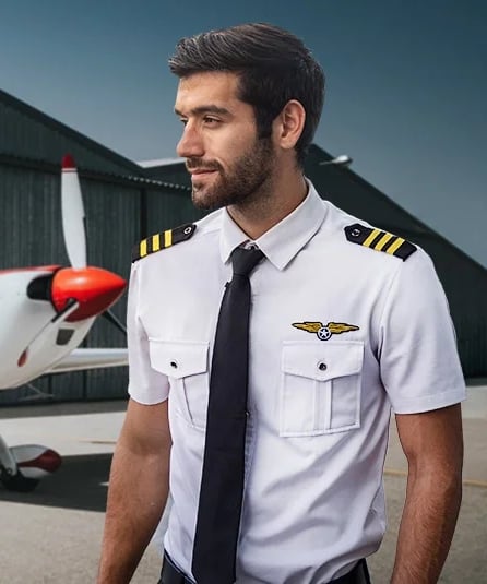 Commercial Pilot standing before pilot training school
