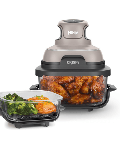 Ninja air fryer with chicken inside and broccoli with salmon in another container