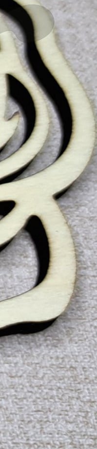 a rose shaped broocher with a rose on it