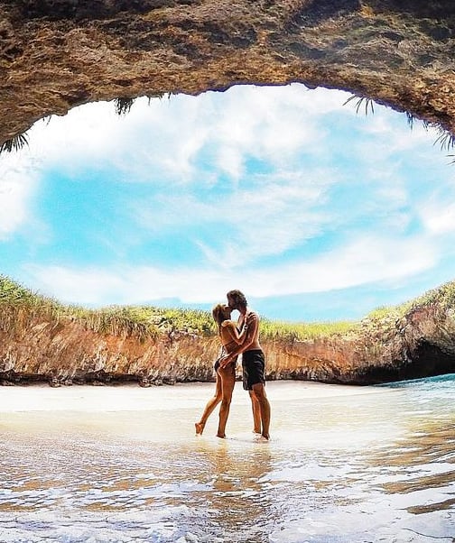 a couple kissing in a cave Marietas