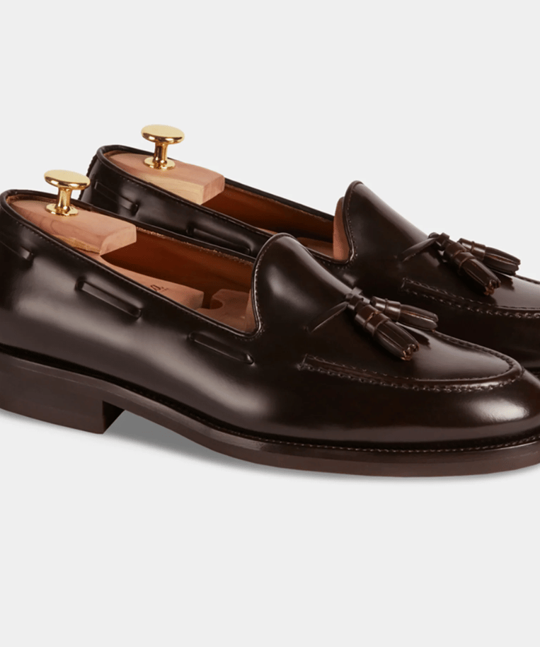 a pair of brown leather tasselled shoes