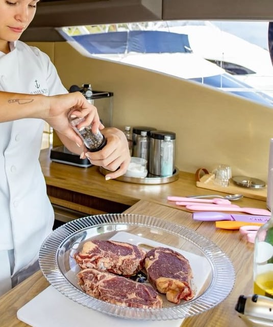 a woman in a white shirt is preparing to cook