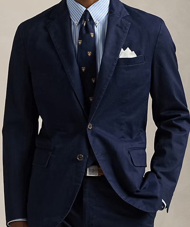 a man wearing a blue navy tailored blazer