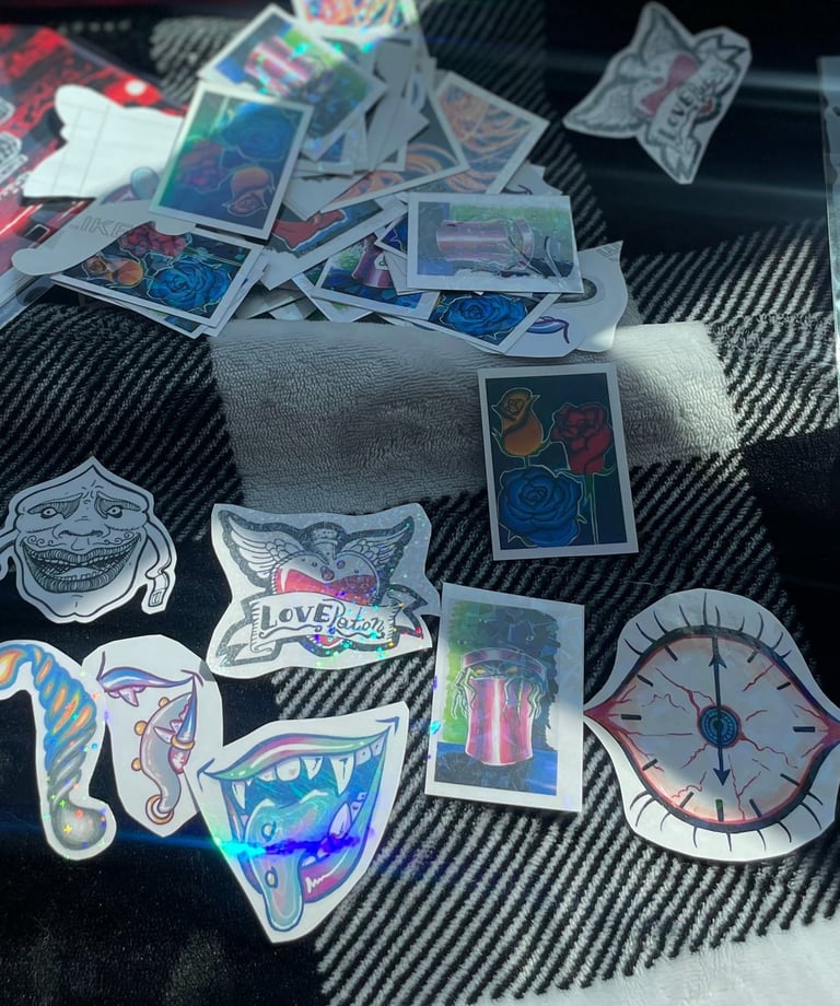 image of handmade stickers, art prints, and paintings