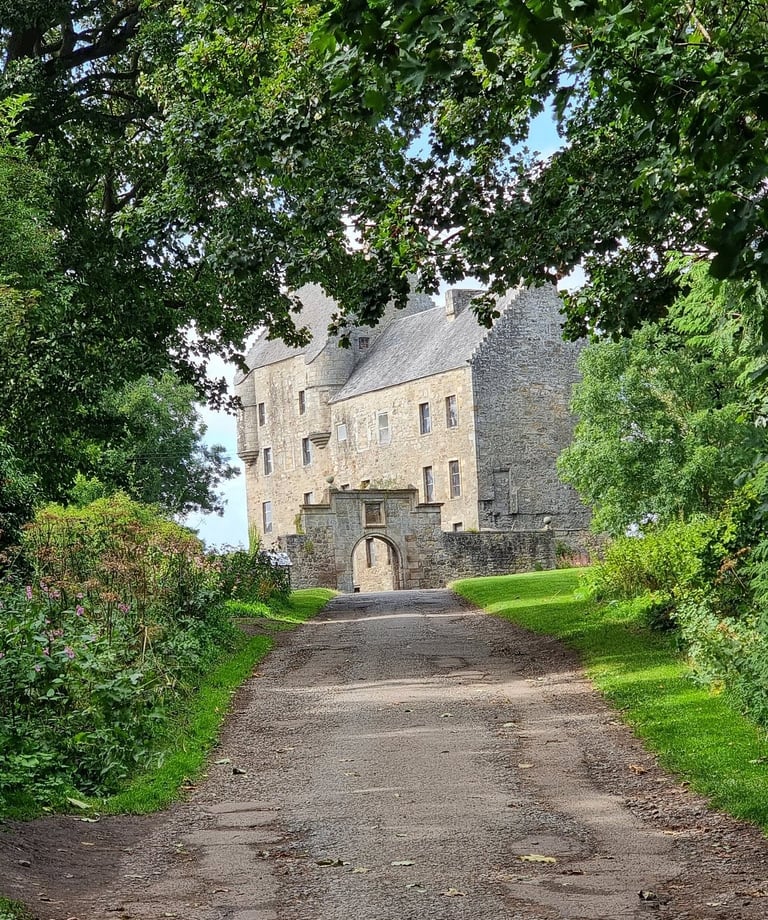 Midhope Castle (Lallybroch) framed by trees