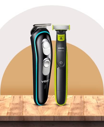 Professional VGR beard trimmer and Philips OneBlade electric shaver displayed on a wooden surface.