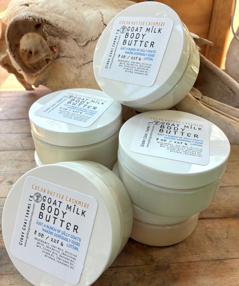 Stacked jars of Giddy Goat Farms Cocoa Butter Cashmere Goat Milk Body Butter for natural skincare.